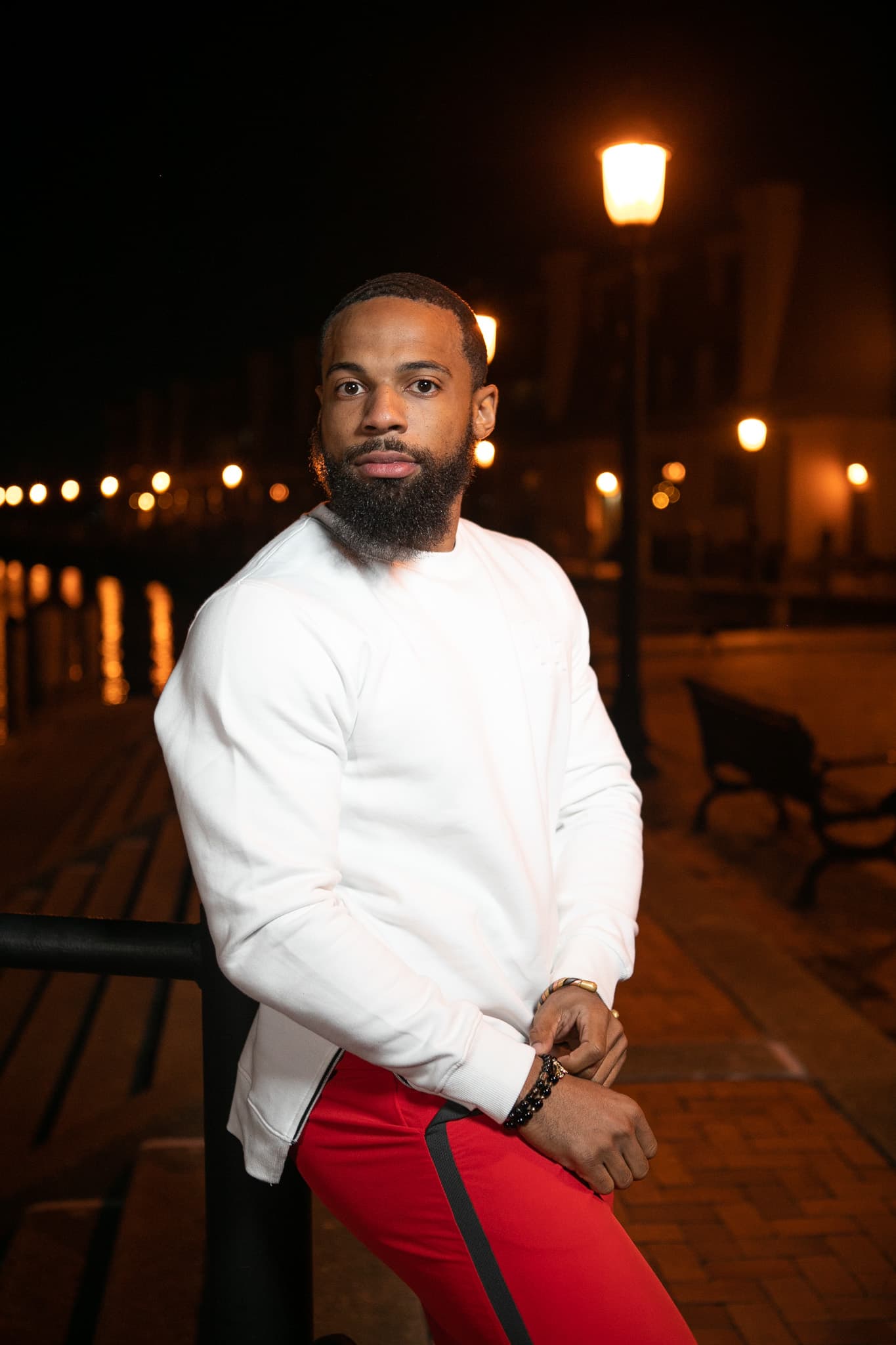 Chris Frazier on a waterfront boardwalk at night